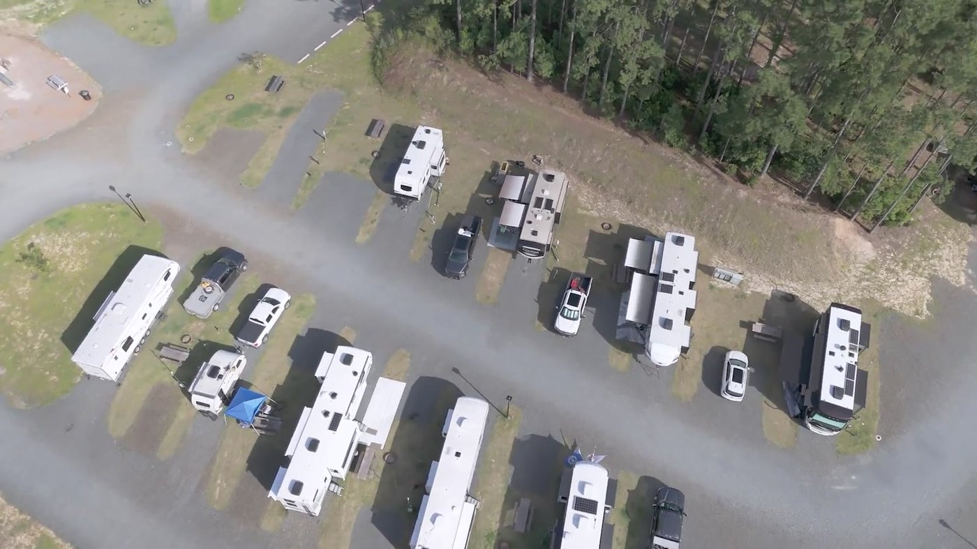 Aerial view of the RV rows at In The Pines, surrounded by pine forest
